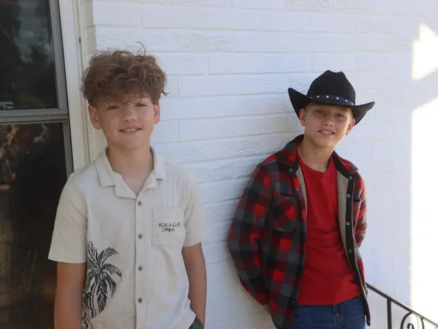 Two boys standing outside the church building