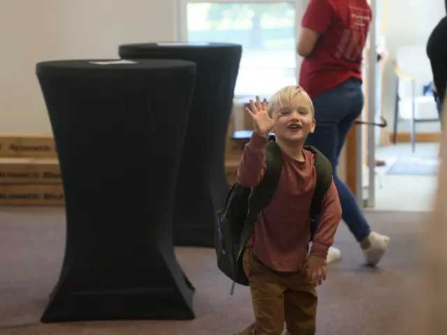 A young boy with a backpack waving as he arrives on Sunday morning
