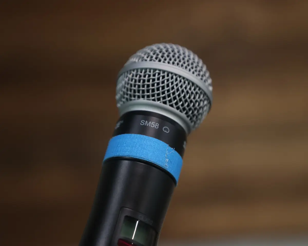 A handheld microphone ready for Sunday worship at Damascus Road Indy